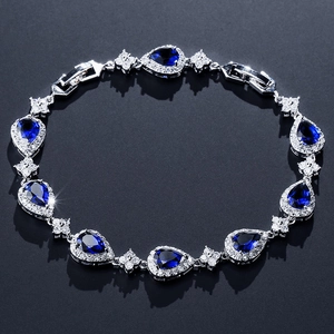 Elegant silver bracelet with pear-cut deep blue gemstones and sparkling white zircon accents