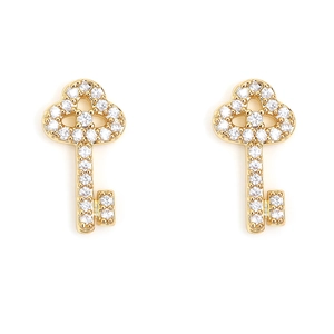 Detailed view of key-shaped gold earrings set with sparkling pavé cubic zirconia