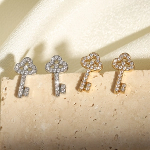Sparkling key-shaped zircon stud earrings in silver and gold finishes for a luxury look