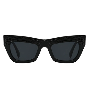 Fashionable oversized cat-eye sunglasses in glossy black with unique wavy textured frames