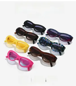 Collage of retro cat-eye sunglasses in various colors with bold geometric frames