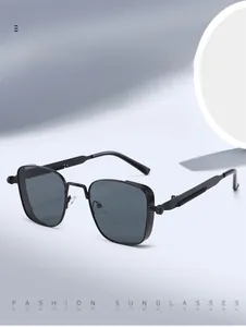 Detail of square black sunglasses showing metal screw accents and spring hinge design