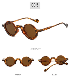 Detail view of retro round sunglasses featuring tortoiseshell frames and dark brown lenses