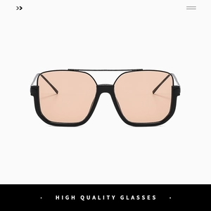 Detail of oversized metal sunglasses with double bridge and orange tinted lenses