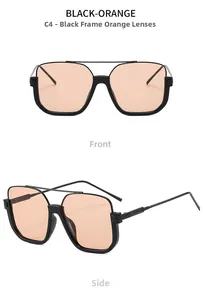 Detail view of double bridge sunglasses with black frames and light orange lenses