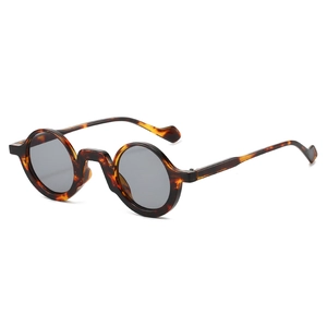 Vintage round tortoiseshell sunglasses with dark grey lenses in high-quality acetate