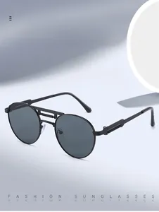 Detail of vintage steampunk sunglasses with black metal frame and spring hinge temples