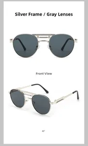 Detail view of vintage punk sunglasses featuring silver metal frames and double bridge design