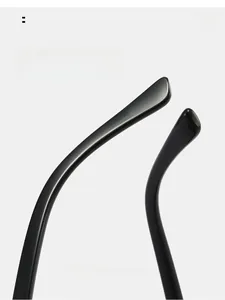 Detailed close-up of ergonomically curved glossy black sunglasses temple for comfortable fit