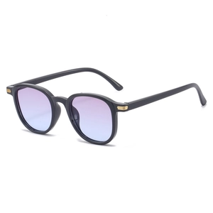 Modern oval sunglasses with black frames, blue gradient lenses and gold accents