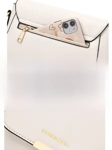 Detail of white PU leather bag featuring gold hardware and a functional back zipper pocket