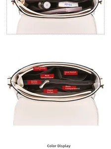 Detailed interior view of minimalist shoulder bag showing multiple compartments and pockets