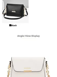 Detail view of stylish minimalist shoulder bag with thick chain strap and metal trim