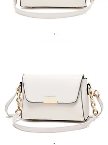 Detailed view of white faux leather bag with gold chain strap and Fashion & Bag logo