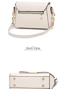 Detail view of beige shoulder bag showing back zipper pocket and golden bottom studs