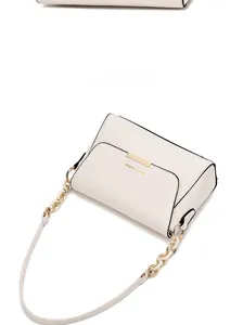 Detail of cream-white shoulder bag showing gold metal trim and FASHION & BAG lettering