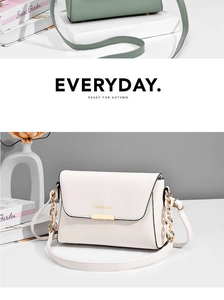 Detail of minimalist cream and green crossbody bags with golden hardware and chain strap