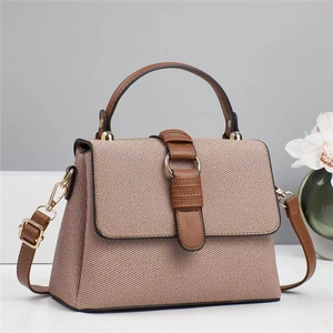 Elegant woven tote bag in beige and brown leather with adjustable strap and gold hardware
