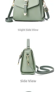 Vue détaillée d'un sac en cuir vert sauge avec breloque cœur et accessoires dorés brillants