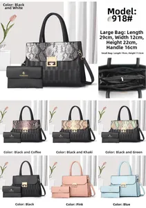 Detail view of large tote and matching long wallet with refined snakeskin patchwork texture