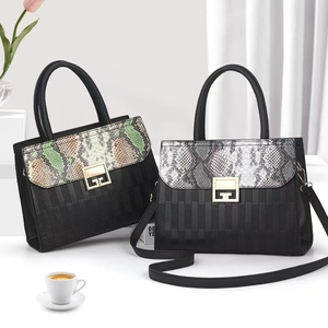 Minimalist faux snake leather shoulder bag with striped texture and gold metal lock