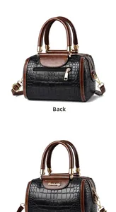 Detail view of the back and side of a retro contrast faux crocodile texture boston bag