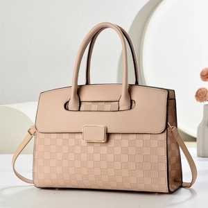 Chic beige crocodile embossed handbag with gold metal clasp and crossbody strap