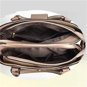 Top view showing large capacity interior with multiple zip compartments of the tote bag