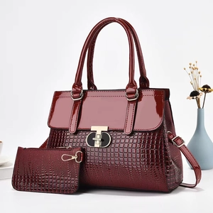 Burgundy faux leather tote bag set with crocodile texture and gold hardware details