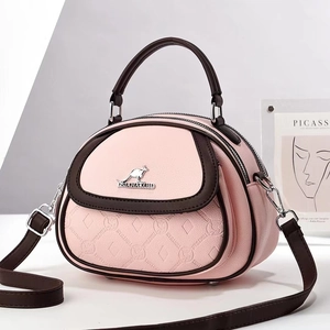 Pink and brown contrast leather crossbody bag with quilted pattern and kangaroo logo