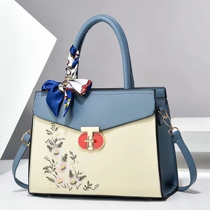 Large color-block tote bag with floral embroidery and silk scarf handle accent