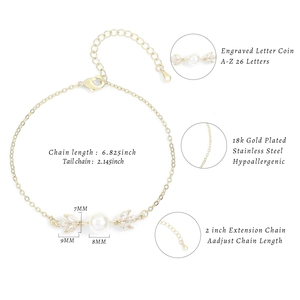 Detailed view of leaf-shaped zircon and pearl clasp on 18k gold plated bracelet