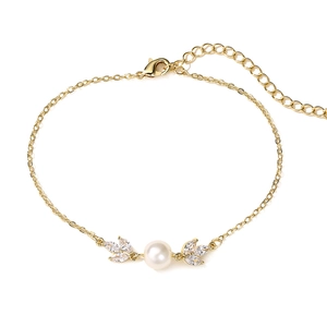 Detail of gold leaf bracelet with white pearl, zircon accents and adjustable lobster clasp