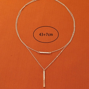 Collier double rang doré avec pendentif barre et strass, mesure de longueur 43+7cm