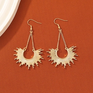 Bohemian gold sunburst dangle earrings with chic long tassels and metallic fishhook drop