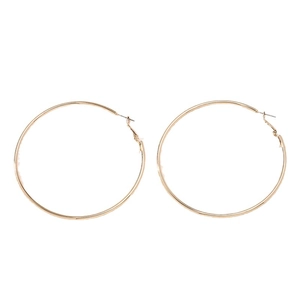 Minimalist large gold hoop earrings with polished metal finish and classic round design