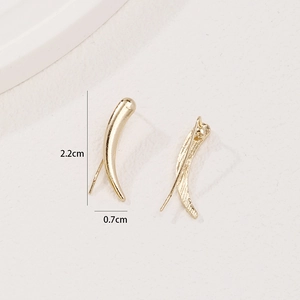 Minimalist gold curved horn earrings with polished finish shown in 2.2cm dimensions