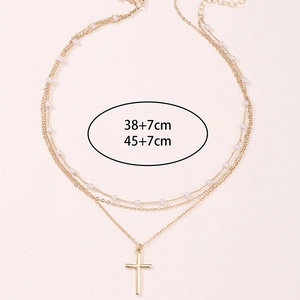 Layered gold cross necklace set with white pearls and 38cm and 45cm adjustable chains