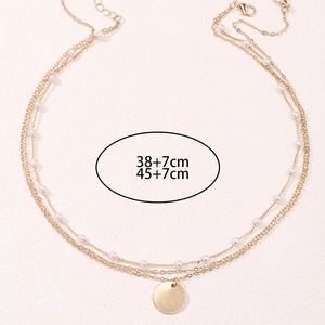 Ensemble de colliers dorés double épaisseur avec perles et pendentifs de 38cm et 45cm