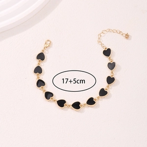 Elegante bracciale a catena dorata con dieci ciondoli a cuore in smalto nero 17+5cm