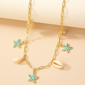 Golden necklace featuring a blue enamel starfish and natural seashell pendant