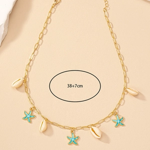 Golden seashell and starfish enamel necklace on beige background, length 38+7cm