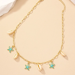 Gold chain necklace with blue enamel starfish and white shell charms for beach vacations