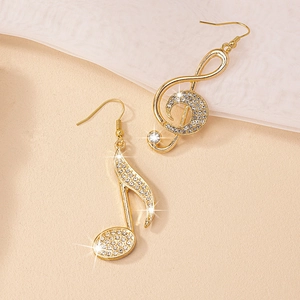 Gold music note drop earrings with sparkling crystals and elegant treble clef design