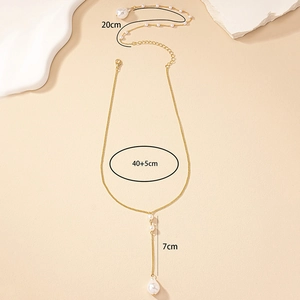 Detail showing gold chain necklace with white pearls and specific length measurements