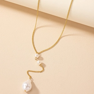 Elegant gold Y-shaped necklace featuring tiered pearls and a baroque pearl drop pendant