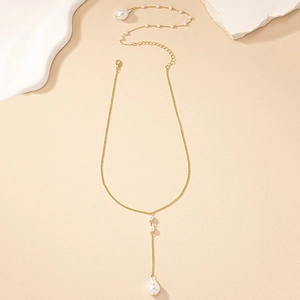 Elegant gold body chain with white pearls and a baroque pearl pendant for back jewelry