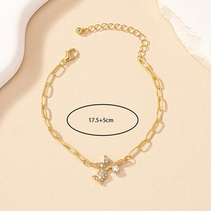 Detailed view of gold chain bracelet with sparkling crystal butterfly pendant, 17.5+5cm