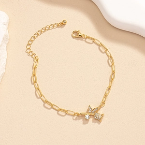 Detail of gold rose bird bracelet with lobster clasp and sparkling rhinestones