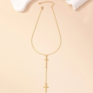 Detail of gold-plated double cross Y-necklace with layered tassels and lobster clasp